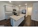 Well-lit kitchen with stainless appliances, granite counters and island with dual sink at 190 Hampton Cir, Mcdonough, GA 30253