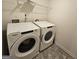 Laundry room with washer and dryer and a white shelf for storage at 190 Hampton Cir, Mcdonough, GA 30253