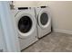 Laundry area with tile flooring and a Whirlpool washer and dryer at 190 Hampton Cir, Mcdonough, GA 30253