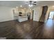 Open floor plan showcasing a spacious living room with hardwood floors and a staircase at 190 Hampton Cir, Mcdonough, GA 30253