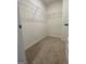 Walk-in closet with a top wire rack for ample storage space at 190 Hampton Cir, Mcdonough, GA 30253