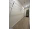 Spacious walk-in closet with hanging racks and built in shelving unit at 190 Hampton Cir, Mcdonough, GA 30253