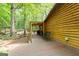 Spacious backyard featuring a back deck, wooden home, and picnic area beyond at 349 Campground Rd, Mcdonough, GA 30253