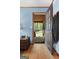 Welcoming entryway with hardwood floors and views of the log cabin's beautiful outdoor setting at 349 Campground Rd, Mcdonough, GA 30253