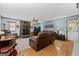 Cozy living room features a stone fireplace and hardwood floors at 349 Campground Rd, Mcdonough, GA 30253