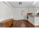 Bright kitchen area with wood floors and modern fixtures and lots of natural light at 397 Campground Rd, Mcdonough, GA 30253