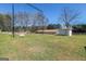 Swing set and outbuilding with a large backyard and green space for activities at 387 Colvin Dr, Locust Grove, GA 30248