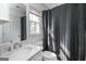 Bright bathroom with a modern vanity, sink, and shower, featuring a window for natural light and ventilation at 387 Colvin Dr, Locust Grove, GA 30248