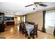 Inviting dining room featuring hardwood floors, natural light, and an open layout to the kitchen area at 387 Colvin Dr, Locust Grove, GA 30248