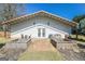 Well-maintained outbuilding with a seating area and manicured landscaping at 387 Colvin Dr, Locust Grove, GA 30248