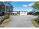 Sprawling two-story home with a spacious driveway and an oversized two-car garage at 387 Colvin Dr, Locust Grove, GA 30248