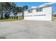 Two-story home, featuring an attached oversized two-car garage and a wide driveway at 387 Colvin Dr, Locust Grove, GA 30248
