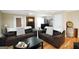 Inviting living room with comfortable seating, hardwood floors, and a fireplace at 387 Colvin Dr, Locust Grove, GA 30248