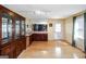Open living space featuring hardwood floors, cabinet with sink and a door to the backyard at 387 Colvin Dr, Locust Grove, GA 30248