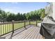 Back deck with wooden planks, overlooking a green lawn and trees at 75 Auburn Rd, Auburn, GA 30011