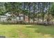 Large backyard area with playground and recreational features at 75 Auburn Rd, Auburn, GA 30011