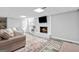 Basement showcasing a brick fireplace and comfortable seating area at 75 Auburn Rd, Auburn, GA 30011