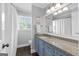 Bright bathroom with vanity, granite countertops and wood flooring at 75 Auburn Rd, Auburn, GA 30011
