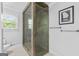 Updated bathroom with glass shower, neutral paint, and flooring at 75 Auburn Rd, Auburn, GA 30011