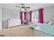 Light-filled bedroom with ample space, ceiling fan and playful decor at 75 Auburn Rd, Auburn, GA 30011