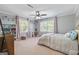 Spacious bedroom offering natural light, ceiling fan, and ample closet space at 75 Auburn Rd, Auburn, GA 30011