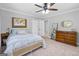 Cozy bedroom featuring soft natural light, ceiling fan, and ample closet space at 75 Auburn Rd, Auburn, GA 30011