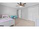 Bedroom with soft carpet and a ceiling fan for optimal air circulation at 75 Auburn Rd, Auburn, GA 30011