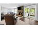 Comfortable living room with a stone fireplace, a television and access to the porch at 75 Auburn Rd, Auburn, GA 30011