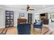 Well-lit piano room with hardwood floors, large windows, and a comfortable seating area at 75 Auburn Rd, Auburn, GA 30011