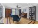 Elegant living area with hardwood flooring, an upright piano, and comfortable blue armchairs at 75 Auburn Rd, Auburn, GA 30011