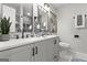 Stylish bathroom with a double vanity, framed mirrors, elegant lighting, and light grey cabinetry at 1770 Atherton Dr, Decatur, GA 30035