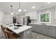 Bright kitchen with stainless steel appliances, quartz counters, stylish gray and white cabinetry at 1770 Atherton Dr, Decatur, GA 30035
