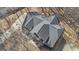 This aerial view showcases the roof and entrance, surrounded by trees and a driveway at 407 Blue Smoke Trl, Peachtree City, GA 30269