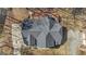 This aerial view showcases the roof and deck, surrounded by trees and a driveway at 407 Blue Smoke Trl, Peachtree City, GA 30269