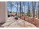 Wooden deck with dining table and chairs, offering a relaxing outdoor space at 407 Blue Smoke Trl, Peachtree City, GA 30269