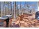 Spacious deck with grill, dining area, and stairs, perfect for outdoor entertaining at 407 Blue Smoke Trl, Peachtree City, GA 30269