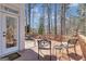 Outdoor deck with furniture and views of the surrounding trees and wooded area at 407 Blue Smoke Trl, Peachtree City, GA 30269