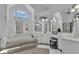 Bright bathroom featuring a soaking tub, vanity with mirror, vanity seating, and ample natural light at 407 Blue Smoke Trl, Peachtree City, GA 30269