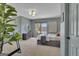 A cozy bedroom with a large plant and modern decor at 407 Blue Smoke Trl, Peachtree City, GA 30269