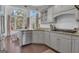 Bright kitchen with granite countertops, stainless steel appliances, and large windows at 407 Blue Smoke Trl, Peachtree City, GA 30269