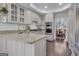 Well-lit kitchen featuring granite countertops, light wood cabinetry, and modern stainless steel appliances at 407 Blue Smoke Trl, Peachtree City, GA 30269