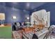 Cozy living room with blue walls, hardwood floors, and classic furniture at 407 Blue Smoke Trl, Peachtree City, GA 30269