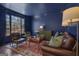 Classic living room featuring hardwood floors and blue accent walls at 407 Blue Smoke Trl, Peachtree City, GA 30269