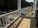 A balcony view, showcasing a spacious parking area and surrounding greenery at 3480 Shepherds Path, Decatur, GA 30034