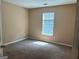 Bright bedroom with natural light showcases neutral paint and carpeted floors at 3480 Shepherds Path, Decatur, GA 30034