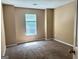Cozy bedroom with neutral paint and ample natural light from the window at 3480 Shepherds Path, Decatur, GA 30034