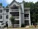 Three-story apartment building with gray siding, white railings, and exterior staircases and balconies at 3480 Shepherds Path, Decatur, GA 30034