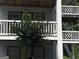 Close-up shot of a multi-story building exterior with gray siding and staircases at 3480 Shepherds Path, Decatur, GA 30034