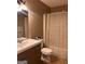 Bathroom featuring a modern vanity, toilet, and shower with curtain at 1725 Sara Se Ct, Conyers, GA 30013