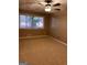 Cozy bedroom featuring a ceiling fan and natural light from a window at 1725 Sara Se Ct, Conyers, GA 30013